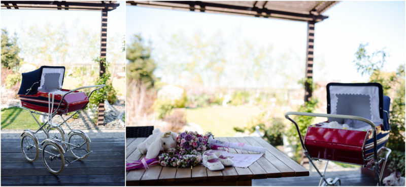 chrzest portret chrzest mała dziewczynka z wiankiem na głowie siedzi pod magnolią