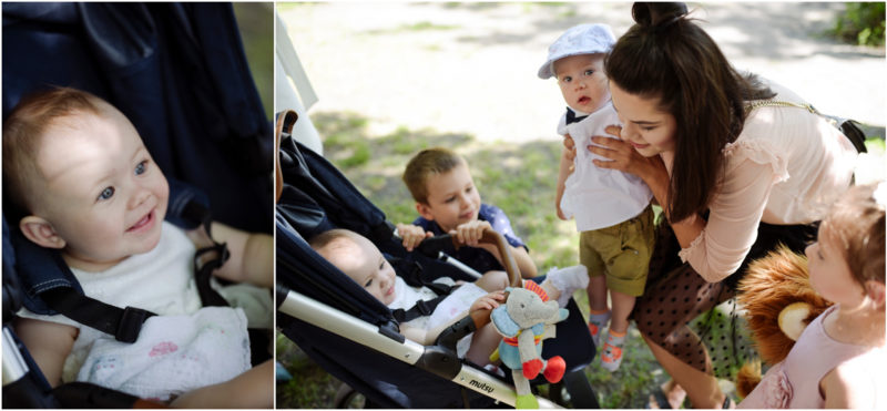 chrzest Wrocław fotografia chrzest Wrocłąw mała dziewczynka siedi na trwaie w parku